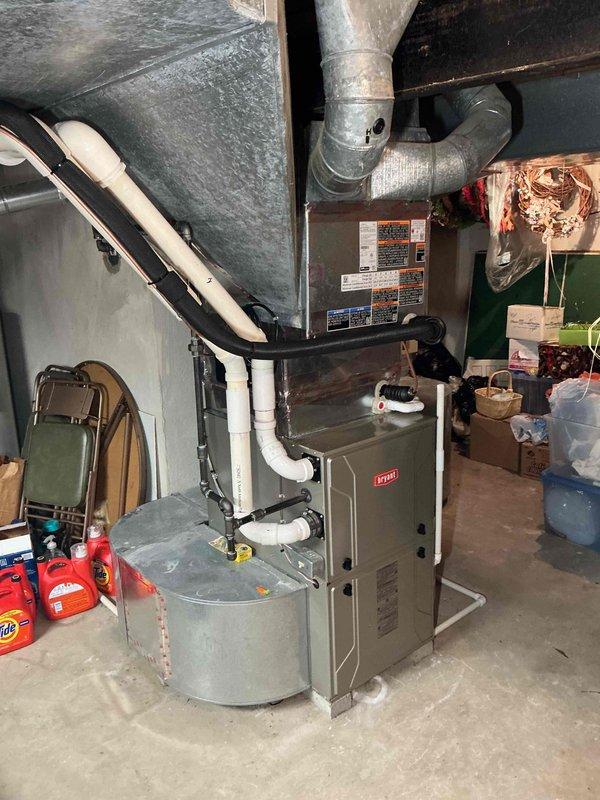 Completed installation of 3.5-ton Bryant air conditioning system with matching evaporator coil in residential basement. Installed ML13XCT-042-230 outdoor condensing unit with rear discharge configuration and reconnected to existing furnace system. Configured electrical disconnect with 35-amp breaker, installed wet switch, and verified proper refrigerant charge and system operation. All mechanical permits obtained and installation completed per manufacturer specifications with PVC condensate drainage properly routed.