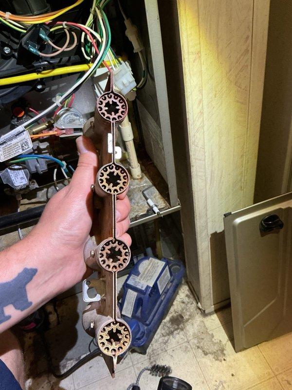 Responded to no-heat call on forced air furnace with intermittent ignition failure and fault code 41/14. Upon inspection, diagnosed failed pressure switch assembly causing improper system operation and preventing ignition sequence. Removed defective four-port pressure switch assembly and replaced with new unit. Tested furnace operation through multiple heating cycles, verified proper ignition sequence, confirmed all pressure switches functioning correctly, and restored full heating capability to system.