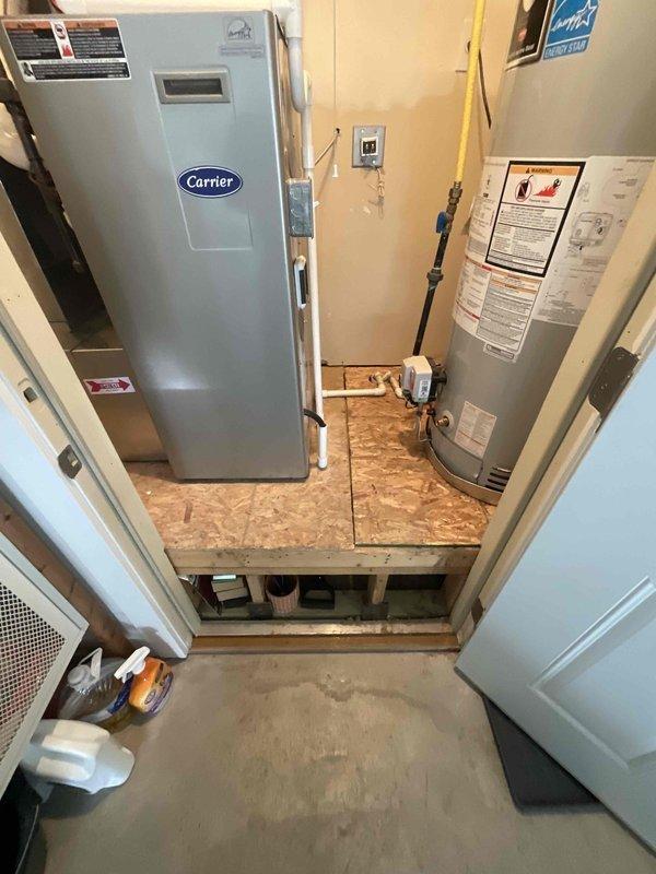Completed indoor air quality estimate for 1,500 square foot townhouse with existing Carrier air handler unit located in utility closet. Assessed current HVAC system configuration and mechanical room layout to determine optimal IAQ equipment integration options for the residential forced-air heating and cooling system.