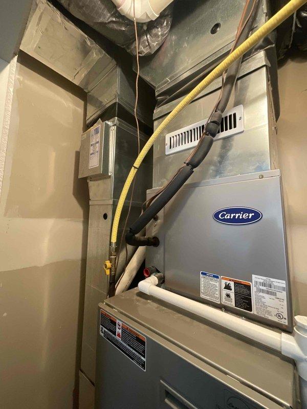 Completed indoor air quality estimate for 1,500 square foot townhouse with existing Carrier air handler unit located in utility closet. Assessed current HVAC system configuration and mechanical room layout to determine optimal IAQ equipment integration options for the residential forced-air heating and cooling system.