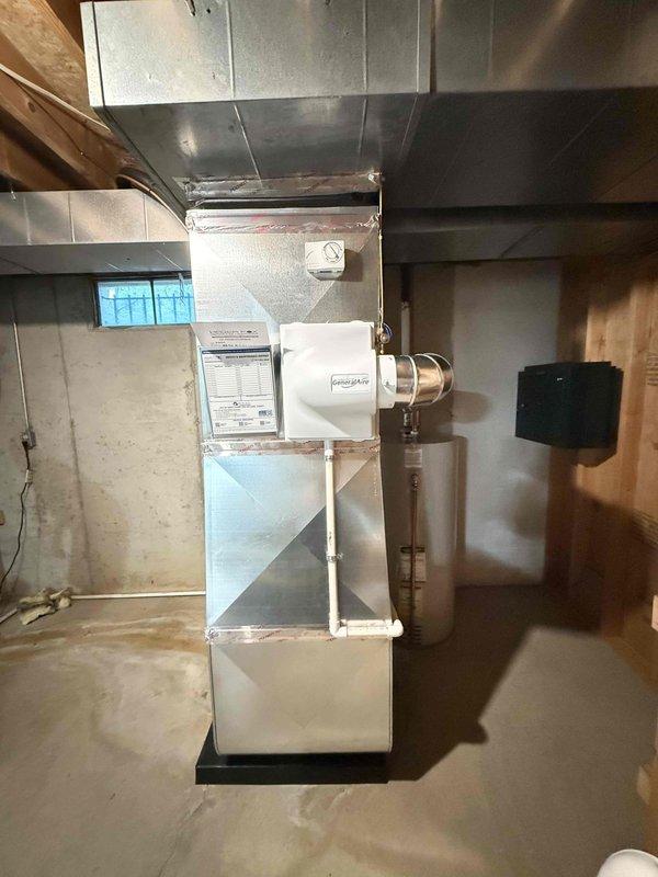 Completed full HVAC system installation in residential basement including 70,000 BTU furnace, 2-ton air conditioning unit with rear discharge configuration, evaporator coil, and humidifier. Connected all ductwork to existing ventilation system, installed cylindrical vent piping, and reconnected electrical components including control panel. Mechanical permit obtained prior to installation, and all equipment positioned and secured per manufacturer specifications in utility room with proper clearances maintained.