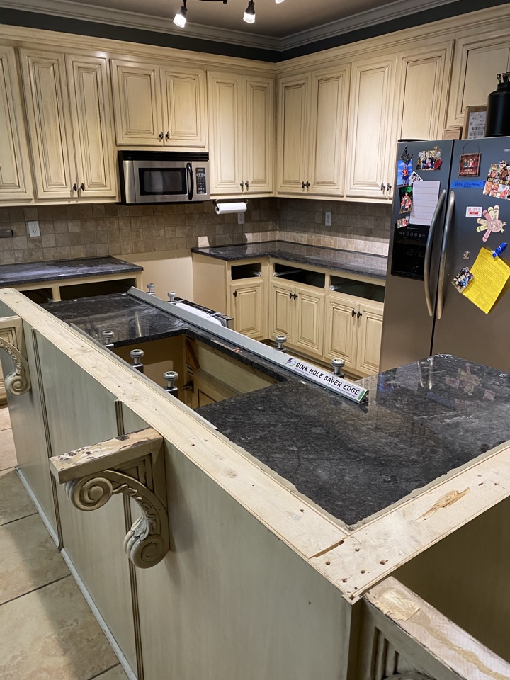 Wetumpka, AL - ProTek restore team installing new granite counter tops. Great looking upgrade for a family recovering from a water damage Wetumpka, AL - ProTek restore team installing new granite counter tops. Great looking upgrade for a family recovering from a water damage