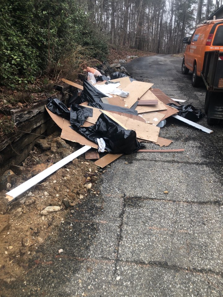 Protek picking up debris from a water mitigation for a satisfied customer in Dadeville.