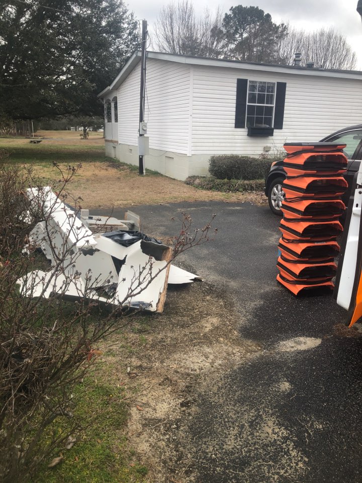 Protek picking up debris and equipment from a water mitigation for a satisfied customer in Notasulga.