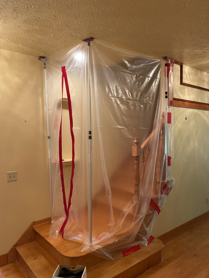 ProTek reconstruction project manager setting up containment in this house that’s about to have hardwood floors sanded and refinished.  