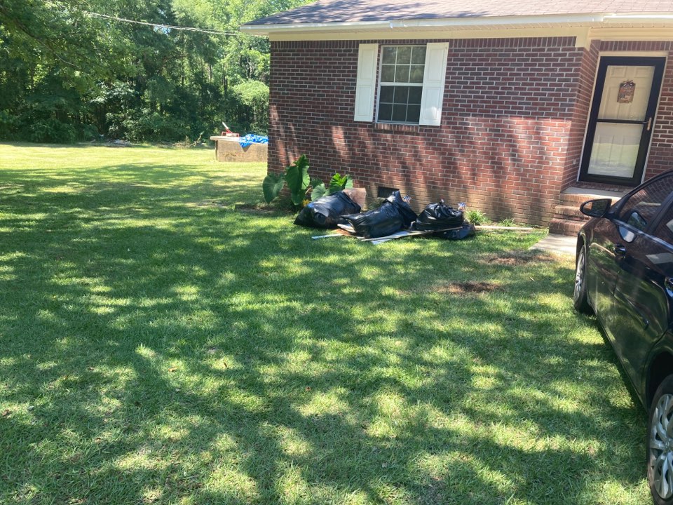 Protek picking up debris from a water mitigation for a satisfied customer in Clanton.