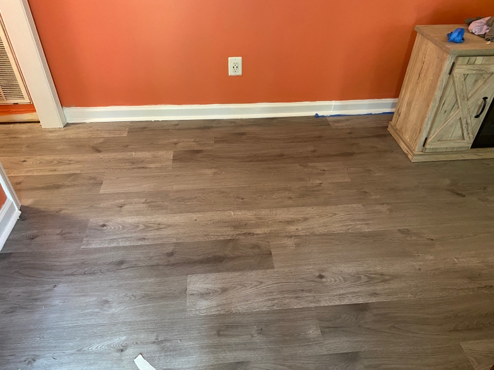 Protek Restoration finishing up this house with new wood and tile floors, new paint, and new baseboards and show mold in this Clanton house. 