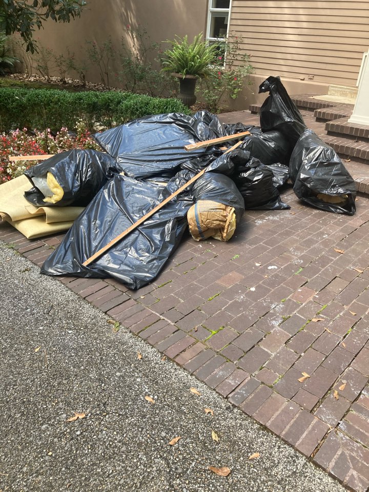 Protek picking up debris from a water mitigation for a satisfied customer in Pike Road.