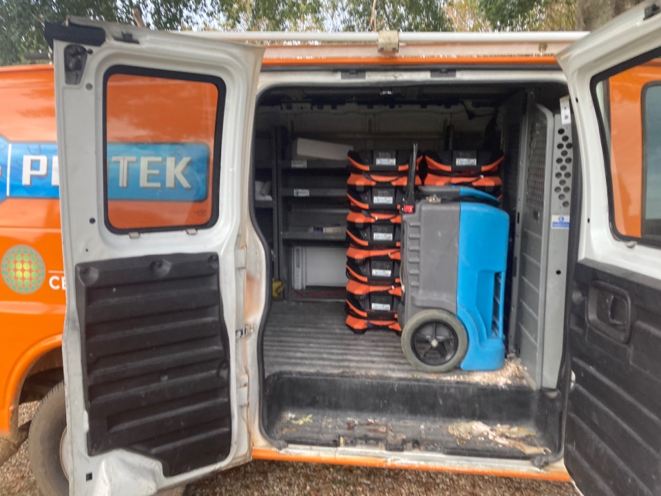 Protek picking up equipment from a water mitigation for a satisfied customer in Millbrook.