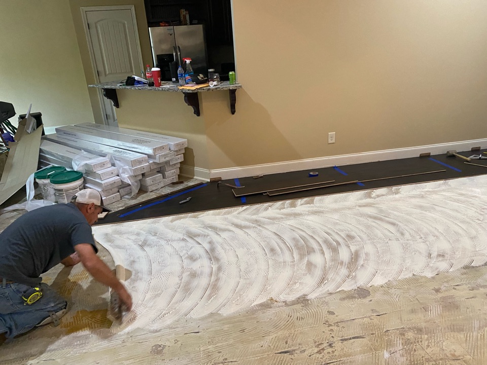 Putting flooring in a beautiful home in Pike rd Alabama done by Protek restoration LLC 