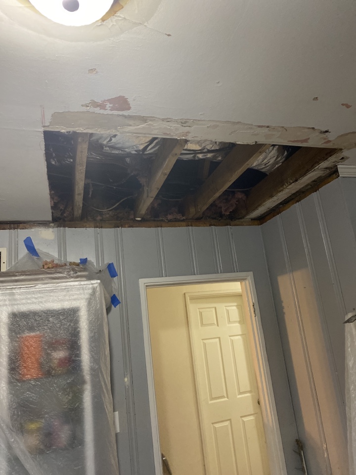 ProTek crew is hard to repair water damage to ceiling and walls. 