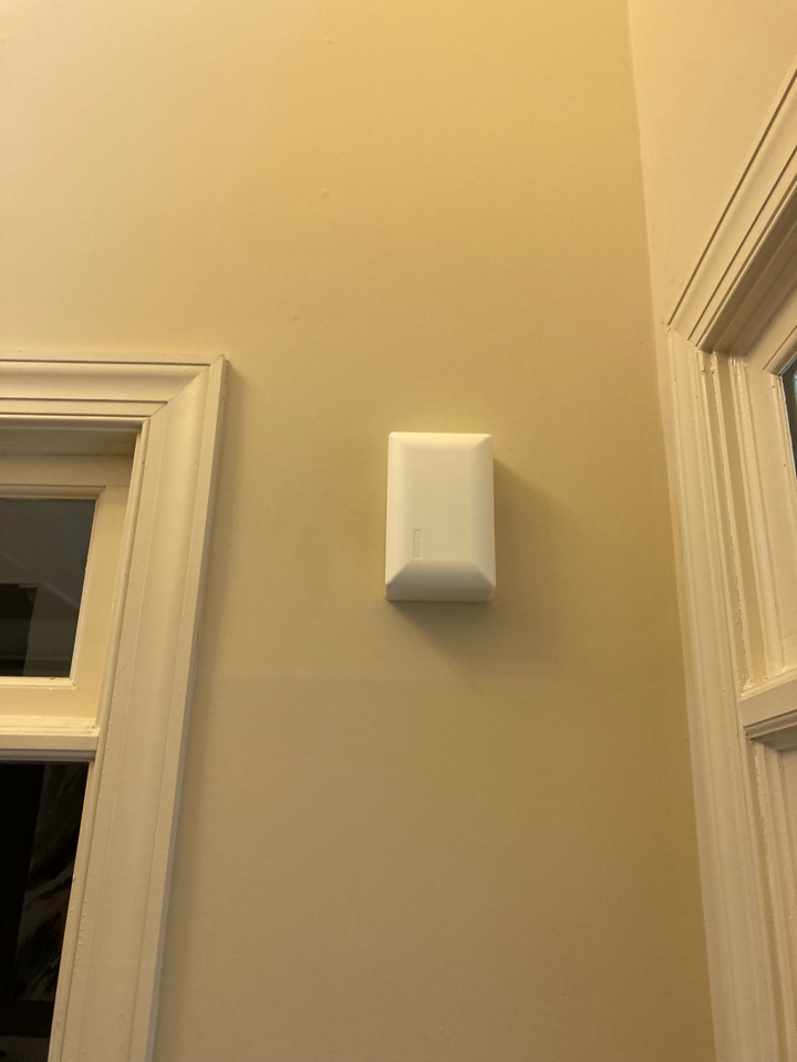 Electrician replacing a faulty doorbell system.