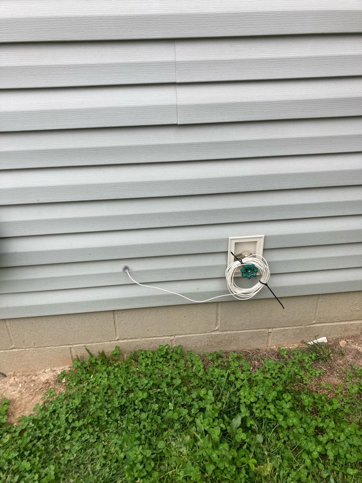 Electricians running a customer supplied fiber optic cable. 