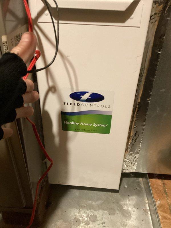 Responded to new customer complaint regarding 13-year-old dual zone HVAC system with upstairs zone set to 68°F but reading 80°F and not shutting off. Diagnosed Carrier system with Field Controls Healthy Home System attachment. Performed diagnostic testing with multimeter on control board and verified temperature readings. Collected $89 for service call plus repair and troubleshooting fees.