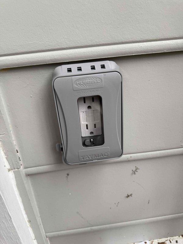 Completed installation of three GFCI outlets including two exterior locations with new weatherproof covers (Hubbell/Taymac brand), installed a standard breaker in panel, mounted two customer-supplied front porch light fixtures with new boxes, and configured a new three-gang light switch for controlling the front porch lighting system. All installations were tested and verified operational.