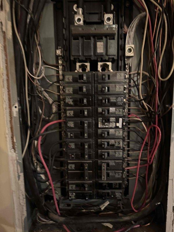 Responded to service call regarding non-functional outdoor lighting. Performed electrical panel inspection, noting panel dating from approximately 1981 with visible wire disorganization. Accessed junction box, removed faceplate, and examined existing wiring connections. Completed necessary repairs to restore functionality to front and back exterior lighting fixtures.