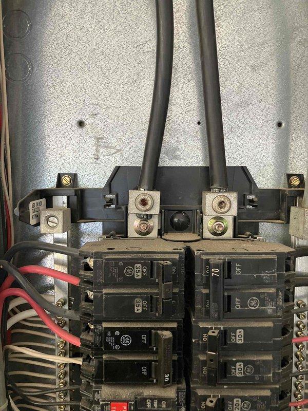 Performed diagnostic inspection on non-functioning ceiling fan and recessed attic light. Inspected 29-year-old electrical panel, which appears to be original to the home. Documented condition of panel with photos showing multiple circuit breakers, wiring, and terminal connections. Discussed options for towel warmer installation in master bathroom.