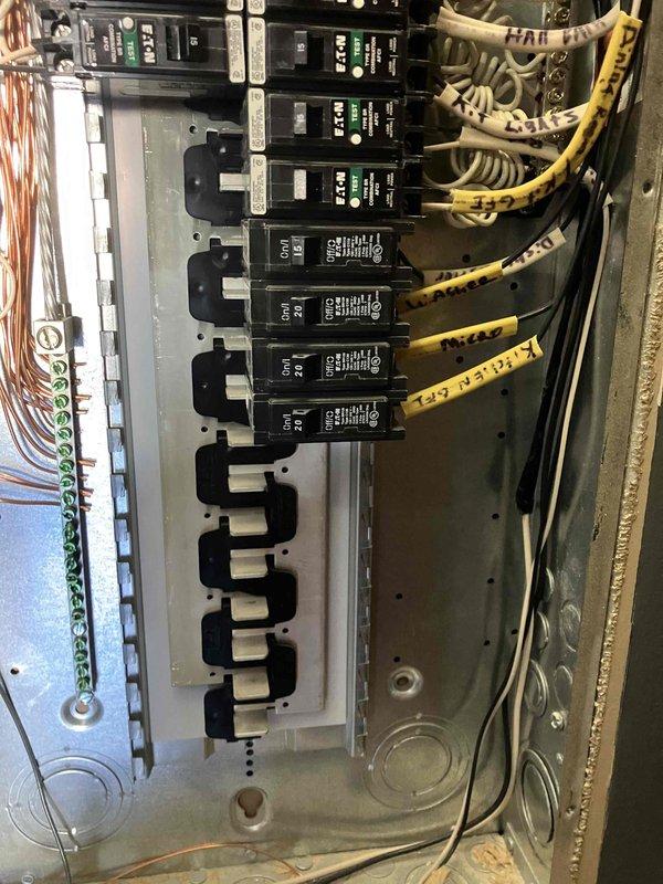 Performed 32-point electrical system evaluation on a 2015 residence. Conducted electrical panel maintenance including torque checking and connection verification of circuit breakers. Tested GFCI/shock protection outlets and Arc Fault breakers to ensure proper functionality. Visual inspection revealed an organized but aging electrical panel with properly labeled circuits and functional breakers showing green indicator lights.