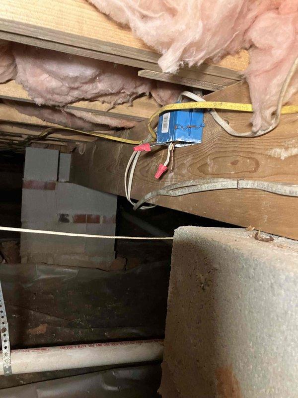 Inspected non-functioning gas fireplace that homeowner had previously been advised required electrical evaluation. Accessed electrical panel and inspected junction box in crawl space, identifying disconnected wiring to the fireplace ignition system. Reconnected and secured wiring with appropriate wire caps, restoring power to the fireplace unit.