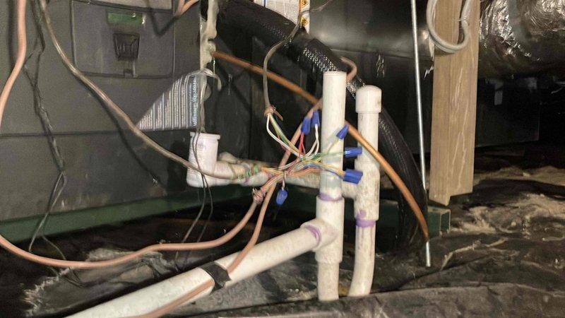 Performed scheduled maintenance tune-up on two residential HVAC units. Inspected plumbing and electrical connections in utility space, noting all components in good working condition. Reset the Trane thermostat's air filter service reminder frequency to 6 months to ensure proper maintenance intervals.