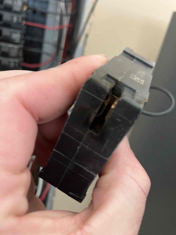 Responded to customer report of smoke odor from electrical panel. Performed inspection and identified damaged circuit breaker with visible crack. Removed the defective breaker and replaced it with new component to eliminate potential fire hazard.