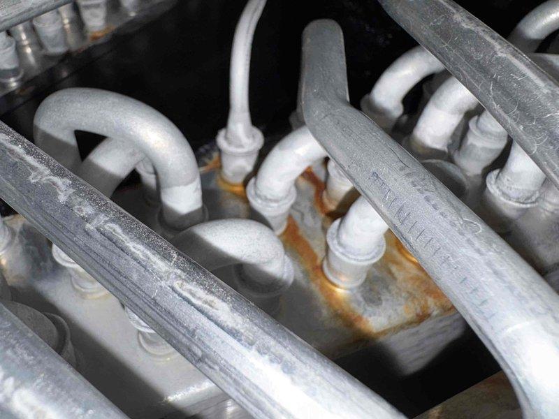 Completed scheduled preventative maintenance service on four HVAC units, performing comprehensive 80-point inspections on each system. Service included cleaning outdoor condenser coils, performing burner cleaning, adjusting gas pressures as needed, and conducting safety inspections. Observed evidence of corrosion at pipe connections and verified proper installation of the SAFE-T-SWITCH SS2 overflow protection device on the control box.