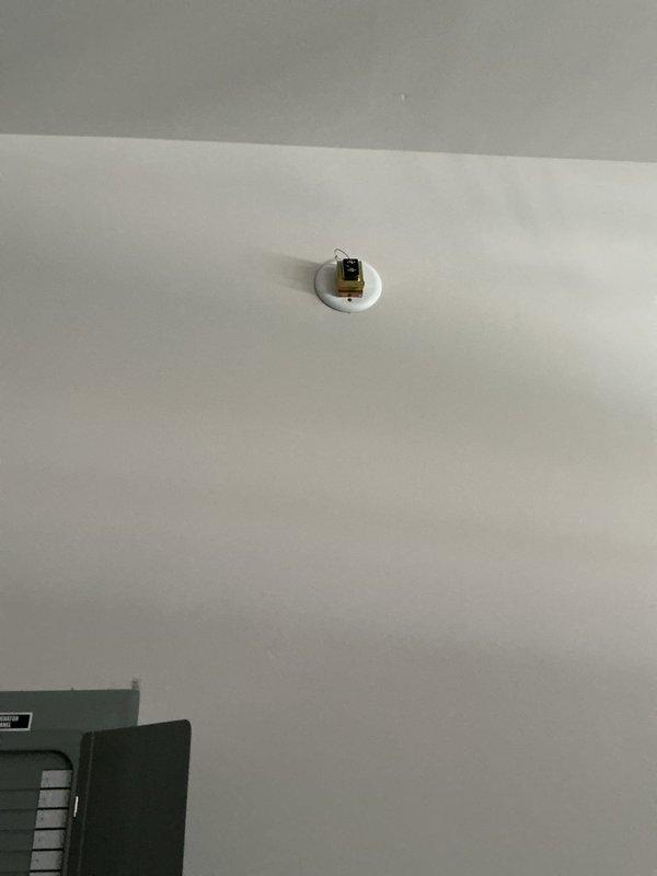 Investigated customer's Ring doorbell system that was improperly installed by builders. Discovered improper wiring connection where two wires were joined with electrical tape instead of proper wire nuts or connectors. Rewired doorbell transformer connection and secured with appropriate wire connectors, restoring functionality to the chime system throughout the house while maintaining camera operation.