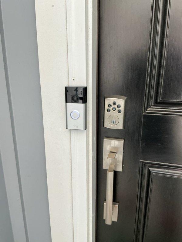 Investigated customer's Ring doorbell system that was improperly installed by builders. Discovered improper wiring connection where two wires were joined with electrical tape instead of proper wire nuts or connectors. Rewired doorbell transformer connection and secured with appropriate wire connectors, restoring functionality to the chime system throughout the house while maintaining camera operation.