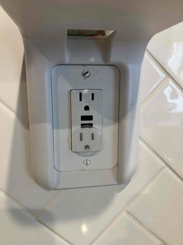 Performed site assessment at 4-year-old residence to evaluate electrical system for potential transfer switch installation. Inspected existing GFCI outlets in tiled area, noting proper installation and functioning. Customer provided with verbal quote for transfer switch options as requested.