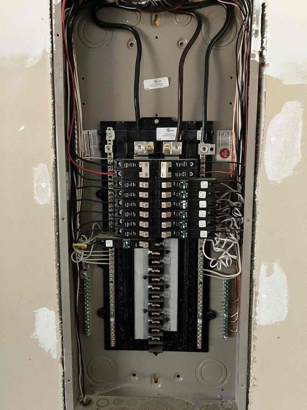 Performed initial assessment of electrical panel for new customer seeking generator outlet installation. Inspected main breaker panel, which showed properly arranged circuit breakers with adequate space for additional circuit. Documented current panel configuration and wiring to develop proper estimate for installing dedicated generator outlet as requested.