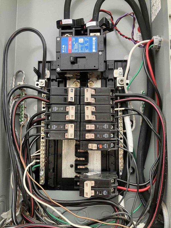 Performed initial assessment of electrical panel for new customer seeking generator outlet installation. Inspected main breaker panel, which showed properly arranged circuit breakers with adequate space for additional circuit. Documented current panel configuration and wiring to develop proper estimate for installing dedicated generator outlet as requested.