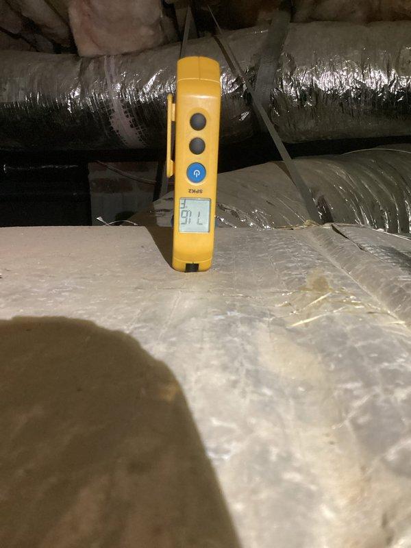 Responded to service call for non-functioning downstairs gas heating system. Diagnostic testing revealed low voltage reading of 18.5V at control board (below required 24V threshold). Further investigation showed 54°F temperature in attic space affecting system operation. Restored proper voltage by adjusting transformer connections and verified blower motor operation. System now functioning normally with proper heat output.