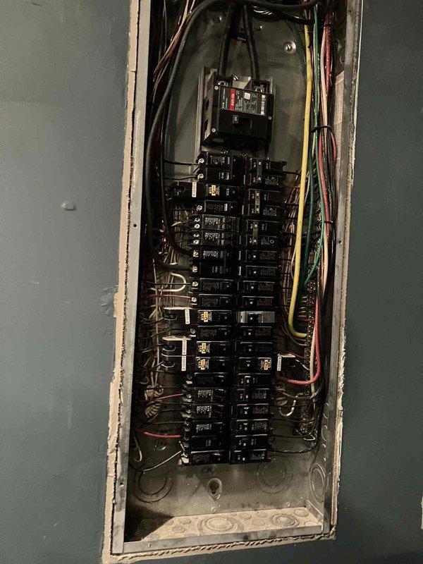 Performed inspection of customer's electrical panel and exterior meter installation. Evaluated replacement options for three tilting can lights with customer's preferred flat fixtures. Assessed feasibility of home network installation after AT&T indicated limitations. Panel inspection revealed properly organized wiring with no immediate concerns.