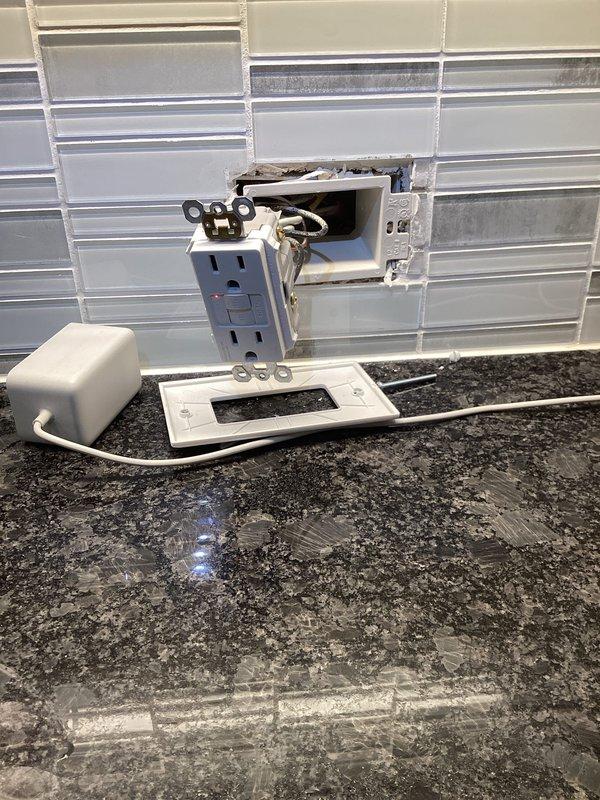 Diagnosed and repaired non-resetting GFCI outlets in customer's home. Inspection revealed faulty GFCI receptacle in kitchen/bathroom area with tile backsplash. Replaced defective GFCI outlet and verified proper operation of the electrical system by checking connections at the main service panel.