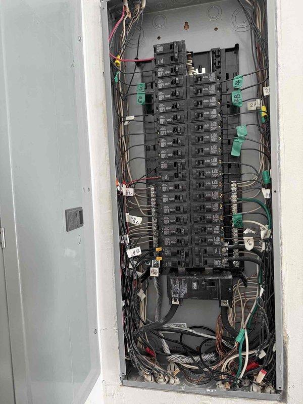 Performed comprehensive electrical service at 30-year-old residence including installation of new GFCI outlet in garage for freezer, removal of intercoms in kitchen and master bedroom with outlet installation in kitchen location, removal of sconce lights at fireplace in family room, and addition of light switch in makeup room. Inspected and diagnosed multiple outlets throughout home that were flagged during previous inspection. Verified proper circuit connections and operation at main electrical panel.