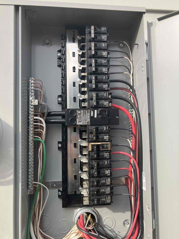 Completed site assessment for EV charger installation at new construction residence. Inspected main electrical service panel (200A) and documented existing circuit configuration. Panel has adequate space for new 50A 240V circuit required for Level 2 charger, but customer is reviewing competitive quotes before proceeding with installation.