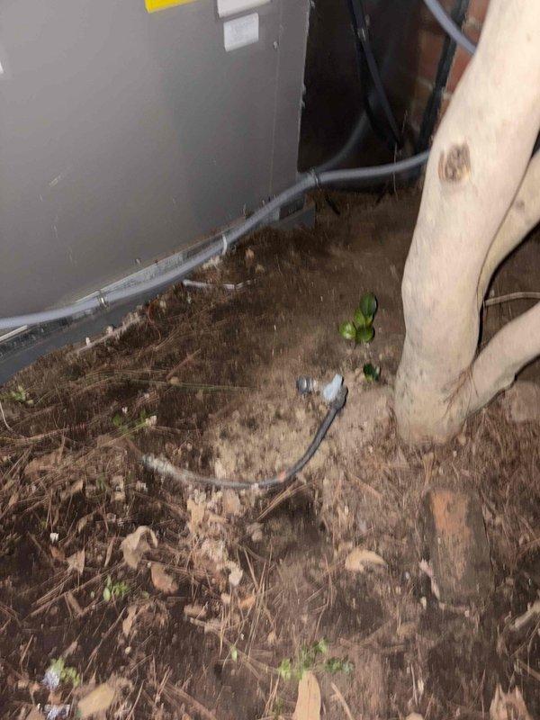 Completed installation of a new HVAC system with both interior and exterior components. The interior unit was installed in the crawlspace with proper electrical connections and drainage lines, while the exterior condensing unit was mounted on a concrete pad adjacent to the brick exterior wall with PVC condensate lines properly routed.