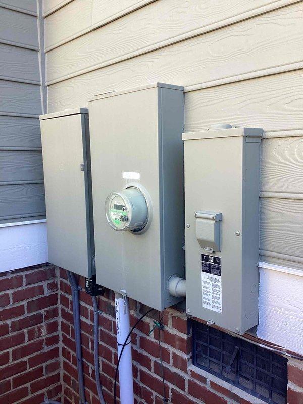 Completed 32-point electrical system evaluation on 2008 home, including panel maintenance with connection torquing, GFCI/Arc Fault breaker testing, and smoke/CO2 detector service with battery replacement. Inspected main electrical panel (Panel A) and exterior meter installation; all systems functioning properly with no issues identified.