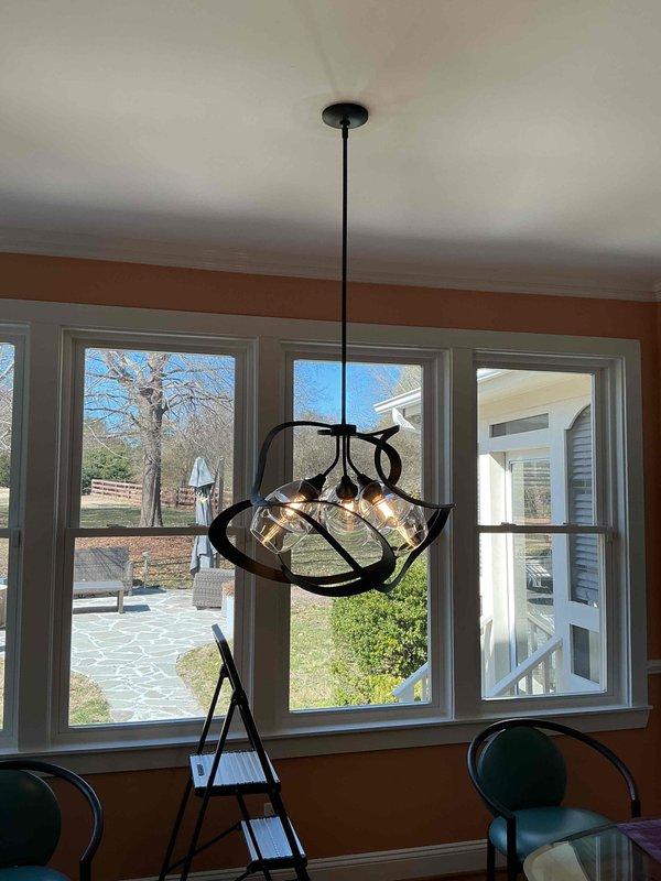 Responded to service call for two loose light fixtures requiring immediate attention. Inspected and secured the pendant light fixture in the dining area and exterior wall-mounted fixture near the electrical meter. Both fixtures were properly tightened to prevent potential hazards and ensure safe operation.