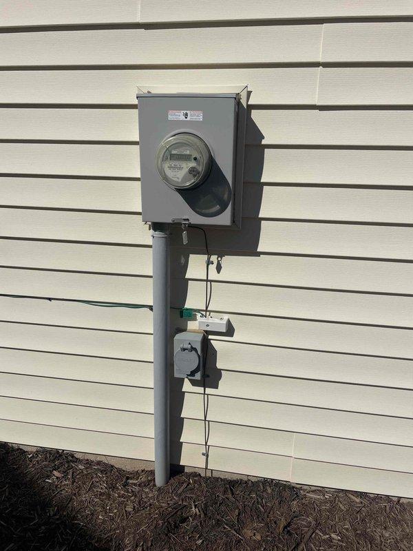 Performed comprehensive 32-point electrical system evaluation including panel maintenance with connection torque verification. Tested all GFCI outlets, Arc Fault breakers, and smoke/CO2 detectors for proper functionality, replacing batteries as needed. Inspected exterior meter installation which appears well-maintained with no visible issues.