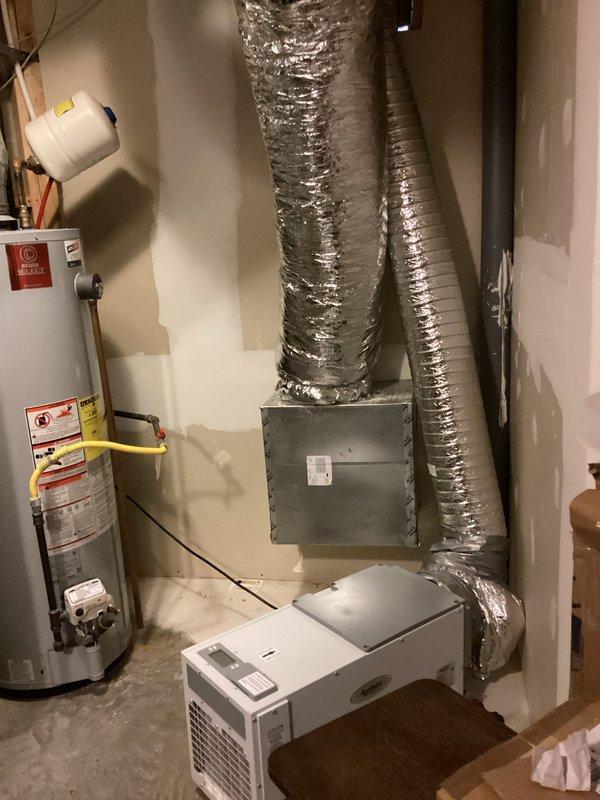 Conducted sales consultation for a homeowner with a 22-year-old dual-unit HVAC system (one serving basement/first floor, another serving second floor). Evaluated existing 3.5-ton unit that's inadequately heating the basement area. Documented current system configuration including air handler/furnace unit, ductwork, and mechanical room layout for proper sizing recommendations on potential system upgrade.