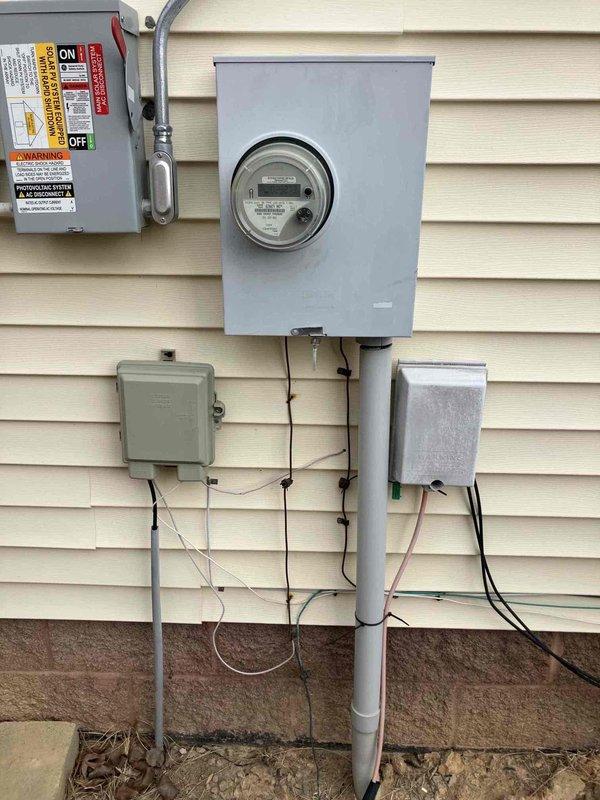 Responded to service call regarding home inspection findings. Replaced expired smoke detector as required by home sale inspection. Evaluated electrical setup for washer/dryer installation and installed appropriate breaker to protect water source appliances per code requirements. Documented existing electrical service panel and meter configuration with photos for record.