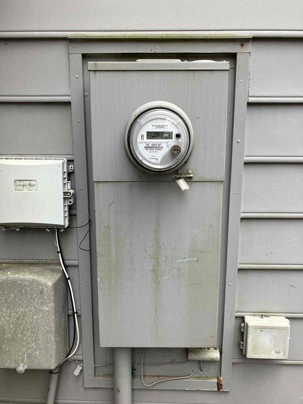 Performed site assessment for installation of portable generator with transfer switch at 40-year-old residence. Examined main electrical panel and exterior meter to evaluate integration requirements. Discussed customer's request for natural gas connection compatibility with the generator system.