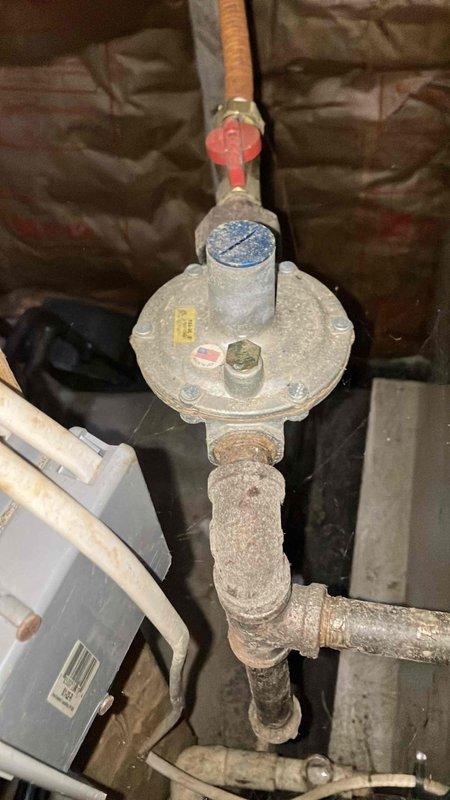 Responded to service call for newly installed Nest thermostats requiring verification for electric company. Inspected gas regulator valve system showing signs of age and dust accumulation. Diagnosed and corrected functionality issue with one thermostat, ensuring proper system operation and completing verification requirements needed for electric company documentation.