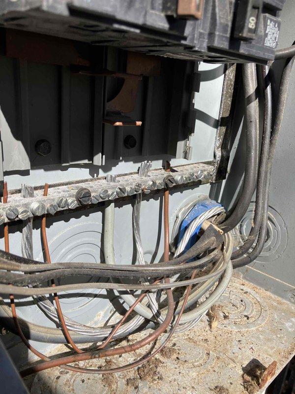 Responded to service call for master bathroom outlet that damaged hair dryer prong. Inspected electrical panel and found signs of corrosion on terminal block with accumulated dust. Replaced damaged outlet and cleaned terminal connections to prevent future overheating issues.