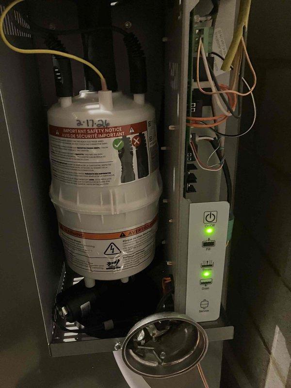 Conducted supervisory assessment of recurring humidifier malfunction. Inspected electrical connections at main panel and control box, examined the humidifier reservoir and control panel with LED indicators. Retrieved canister for further analysis as this represents the third service call for the same issue since installation.