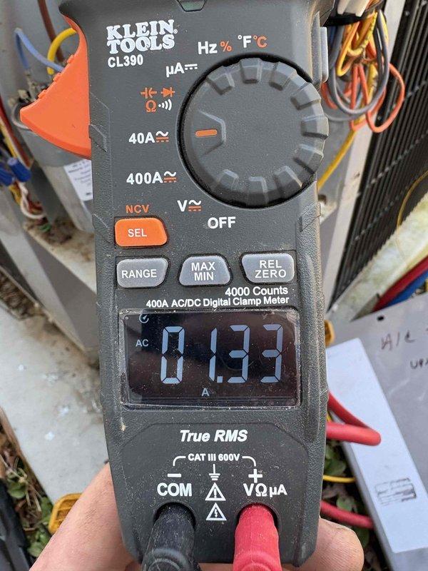 Completed low pressure switch repair on refrigeration system by identifying and repairing leaking braze joint. Service included complete refrigerant recovery, system evacuation, and proper recharge, with electrical measurements confirming proper operation at 0.93A as verified with Klein Tools CL390 clamp meter.