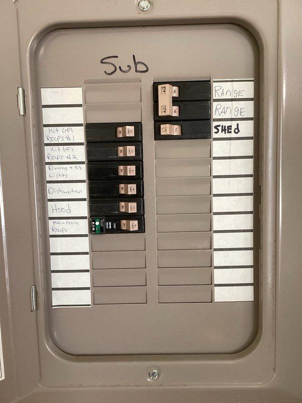 Completed PTAC unit installation with customer-provided equipment. Inspected electrical sub-panel to ensure proper circuit configuration and verified heat exchanger/condenser coil integrity (unit serial #2406G15902, model #PZH09K3SC) prior to final installation and testing.