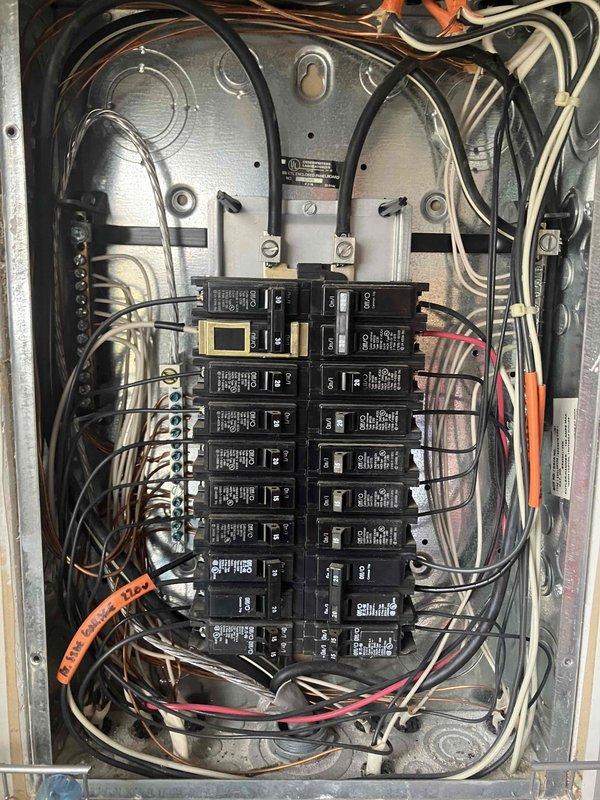 Responded to service call regarding tripped breaker connected to septic tank pump. Performed thorough inspection of electrical panel, examining circuit connections and wiring integrity. Identified potential underground short causing breaker trips and documented findings with detailed photos of panel components and terminal connections for further evaluation.