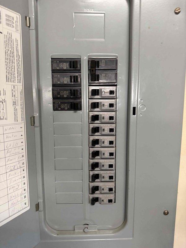 Conducted system replacement evaluation for no AC service issue. Inspected electrical panel, noting available breaker space and current circuit configuration. Examined attic HVAC unit, documenting existing equipment placement, ductwork configuration, and insulation conditions. Photos taken of both electrical panel and attic installation area for replacement planning purposes.